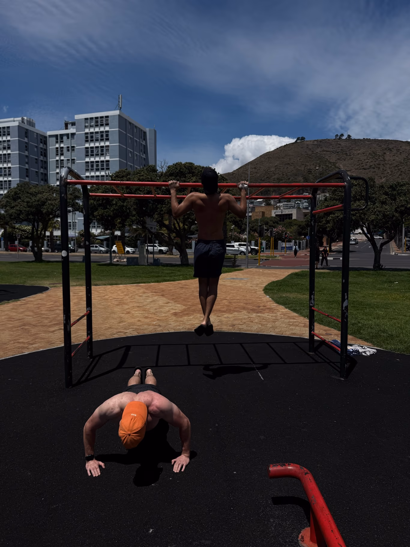 A founder stretching alone on a quiet lawn at a Helix off-site — recovery built into the calendar