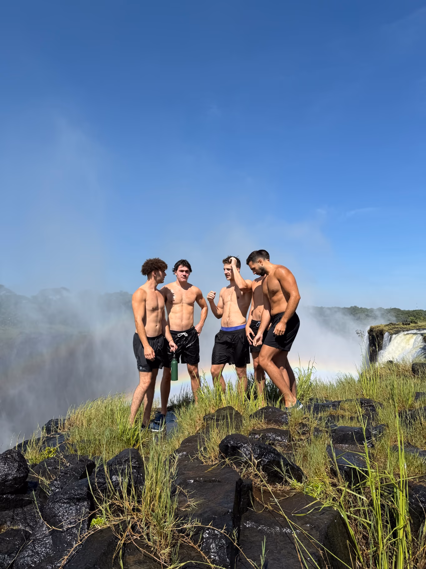 Helix founders at a waterfall on a trip — the table taken off the grid