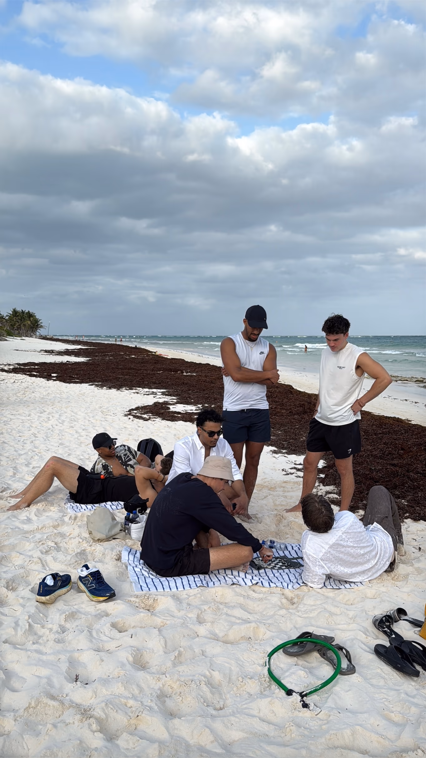 Founders standing together on a beach looking out to sea — the antidote to founder loneliness