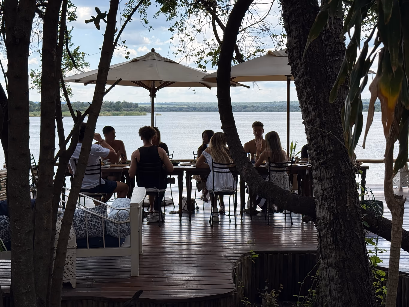 Founders around a table by the water — the four kinds of support in one room